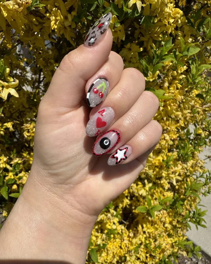 Lucky Sparkle: silver sparkle nails with hand-painted cherries, a heart, an eight ball and a star