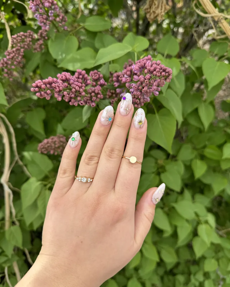 Milky Pearl: milky white nails with tiny gems and flower accents